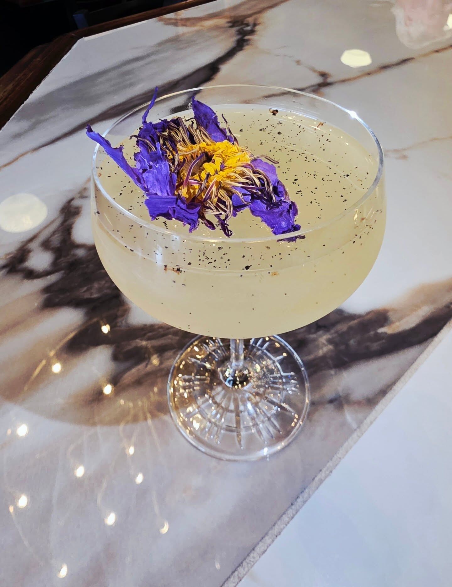 Cocktail with dried flower garnish at Borracho's